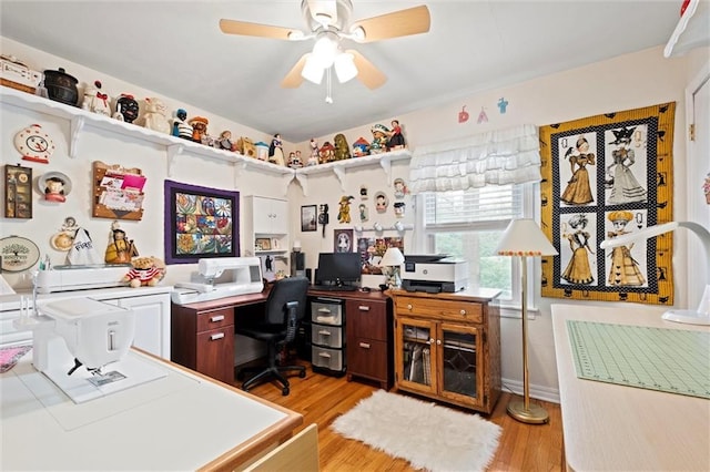office area with ceiling fan and light wood-style floors