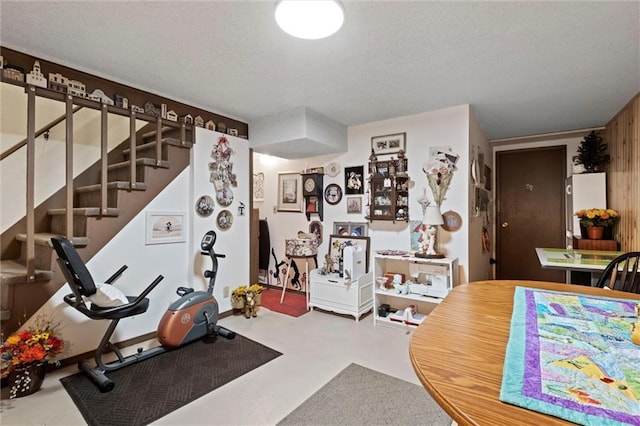 workout room with a textured ceiling
