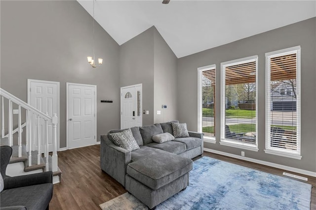 16754 W 156th Ter, Olathe, KS 66062 - living room featuring high vaulted ceiling, plenty of natural light, baseboards, and stairway