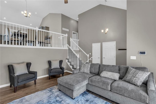 16754 W 156th Ter, Olathe, KS 66062 - living area featuring a chandelier, high vaulted ceiling, wood finished floors, stairs, and baseboards