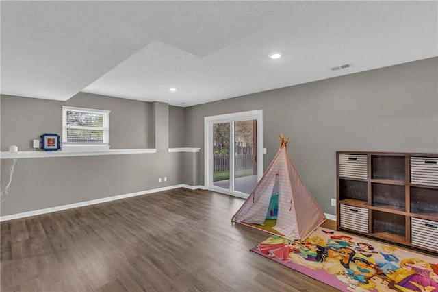 16754 W 156th Ter, Olathe, KS 66062 - rec room featuring wood finished floors, recessed lighting, and baseboards