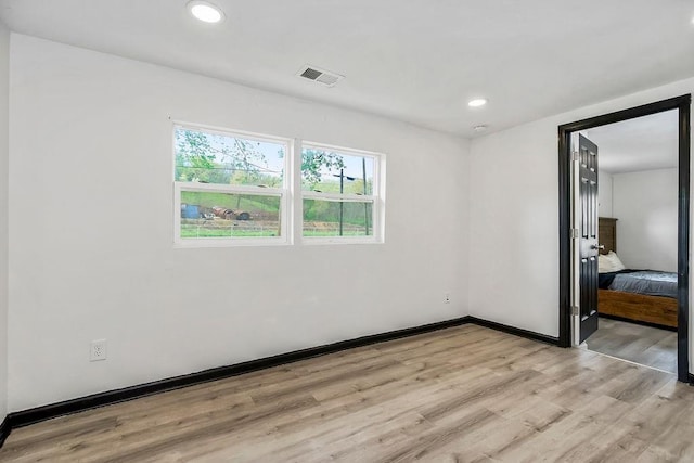 unfurnished bedroom with recessed lighting, baseboards, visible vents, and light wood-style flooring