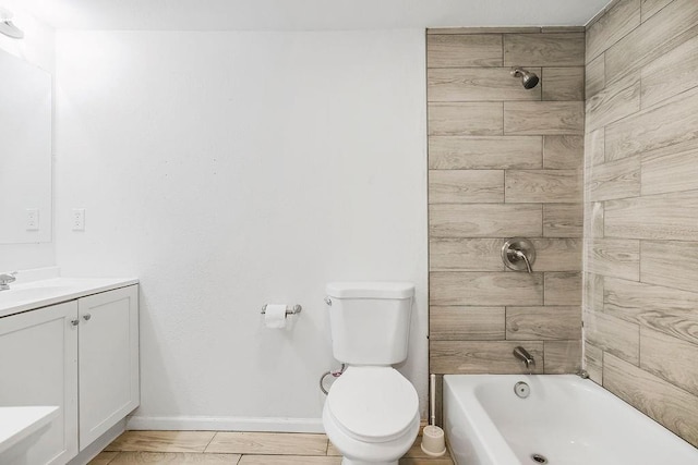 bathroom with toilet, vanity, shower / bath combination, and baseboards