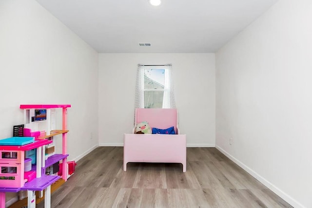 game room featuring baseboards, wood finished floors, visible vents, and recessed lighting