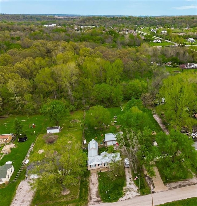 aerial view featuring a wooded view