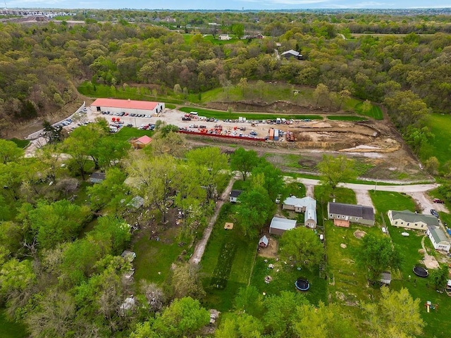 aerial view featuring a wooded view