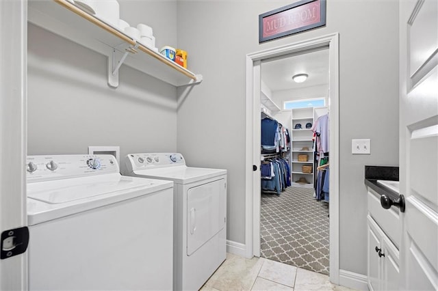 24212 W 69th St, Shawnee, KS 66226 - washroom with washer and dryer, cabinet space, and baseboards