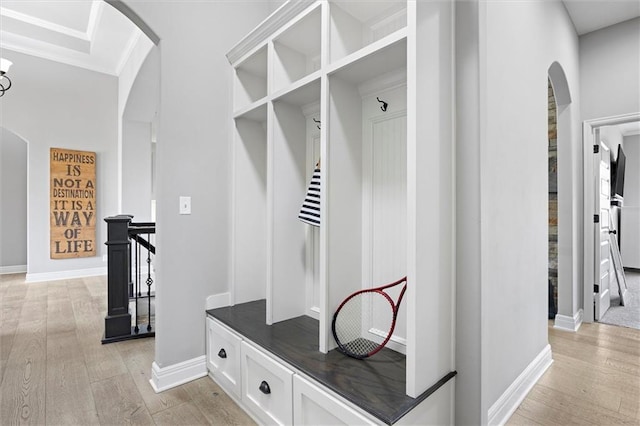 24212 W 69th St, Shawnee, KS 66226 - mudroom featuring arched walkways, light wood-style floors, ornamental molding, and baseboards