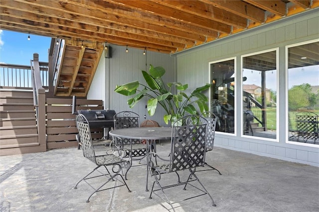 24212 W 69th St, Shawnee, KS 66226 - view of patio / terrace featuring stairs, outdoor dining space, and a grill