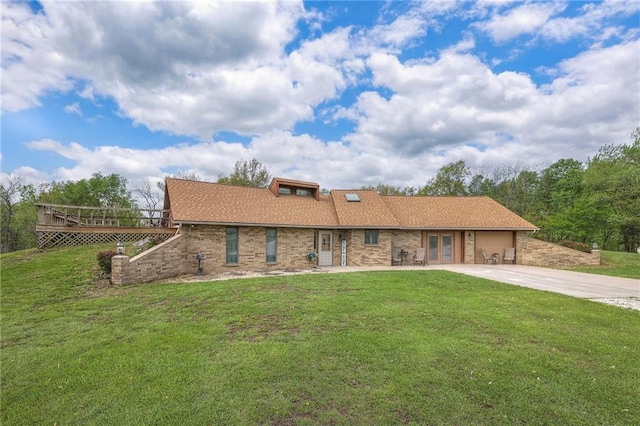 24101 E 223rd St, Harrisonville, MO 64701 - view of front of house with driveway, french doors, a deck, a garage, and a front lawn
