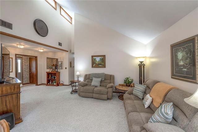 24101 E 223rd St, Harrisonville, MO 64701 - carpeted living room with high vaulted ceiling, baseboards, and visible vents