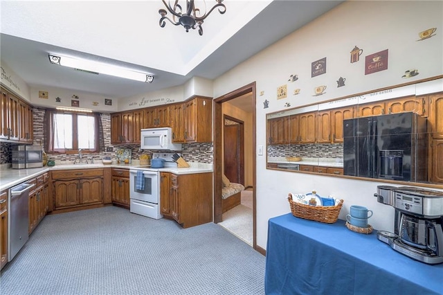 24101 E 223rd St, Harrisonville, MO 64701 - kitchen featuring brown cabinets, a sink, white appliances, light countertops, and backsplash