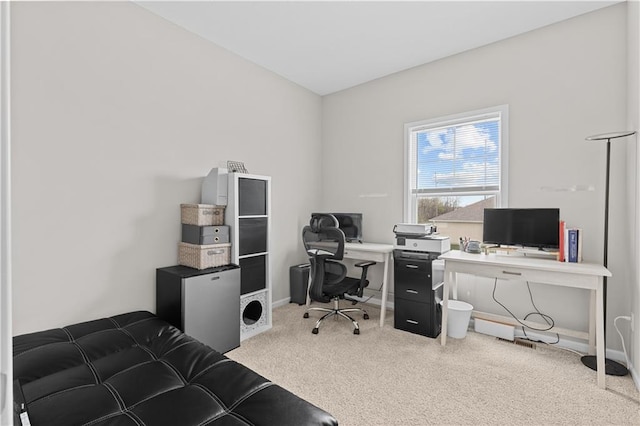 office area featuring baseboards and carpet