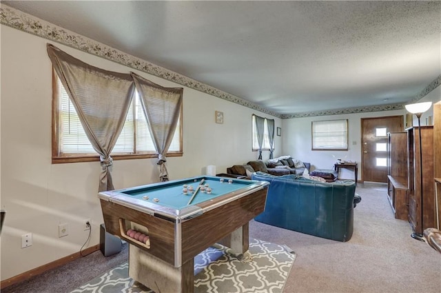 recreation room featuring carpet flooring, a wealth of natural light, a textured ceiling, and billiards