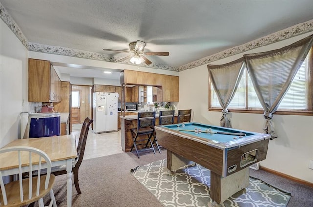 game room featuring light colored carpet, ceiling fan, baseboards, and billiards