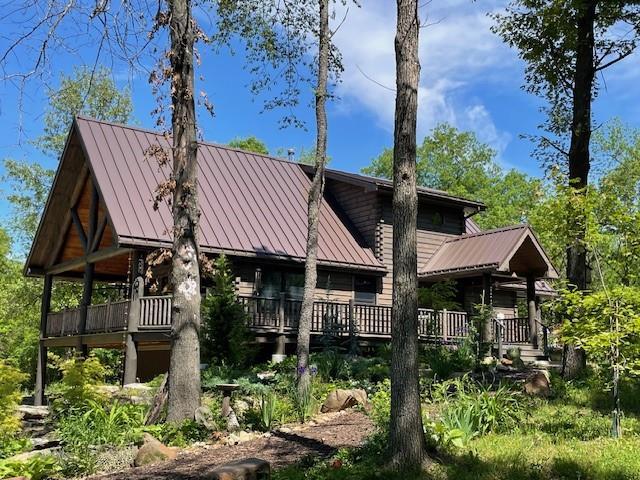185 SW 51st Rd, Warrensburg, MO 64093 - view of front of house with a standing seam roof, metal roof, and a deck