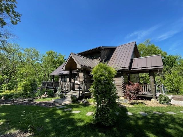 185 SW 51st Rd, Warrensburg, MO 64093 - rear view of property with covered porch, a yard, a standing seam roof, and metal roof
