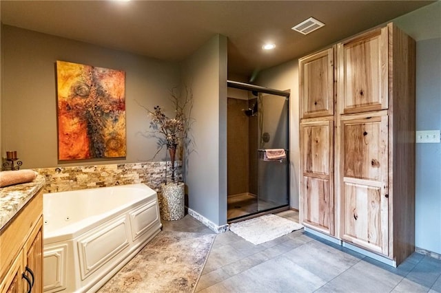 185 SW 51st Rd, Warrensburg, MO 64093 - full bathroom with a shower stall, a bath, recessed lighting, and tile patterned floors
