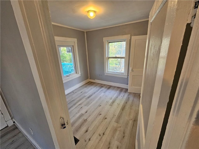 4410 Myrtle Ave, Kansas City, MO 64130 - unfurnished room featuring baseboards, crown molding, and light wood-style floors