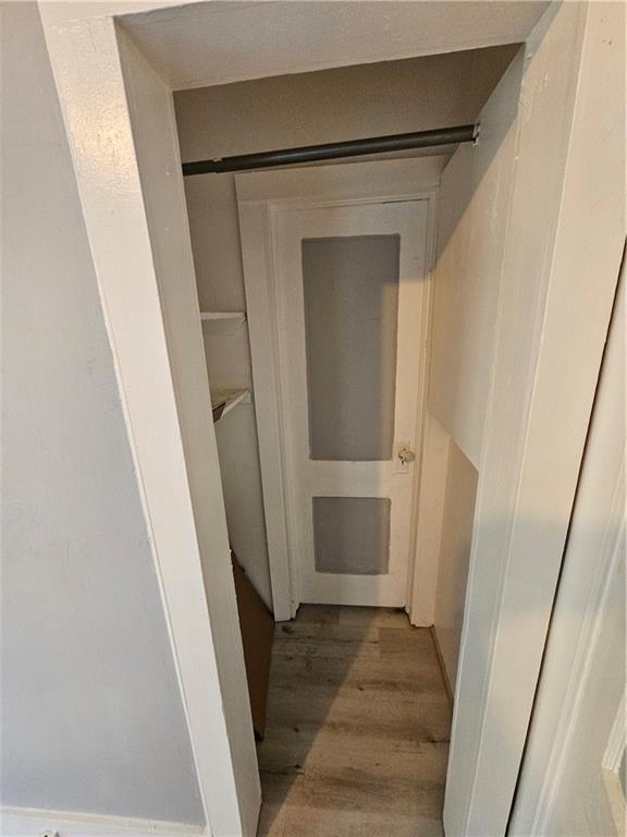 4410 Myrtle Ave, Kansas City, MO 64130 - corridor with light wood finished floors