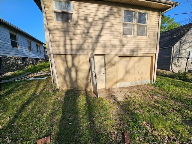 4410 Myrtle Ave, Kansas City, MO 64130 - view of property exterior featuring a lawn and fence