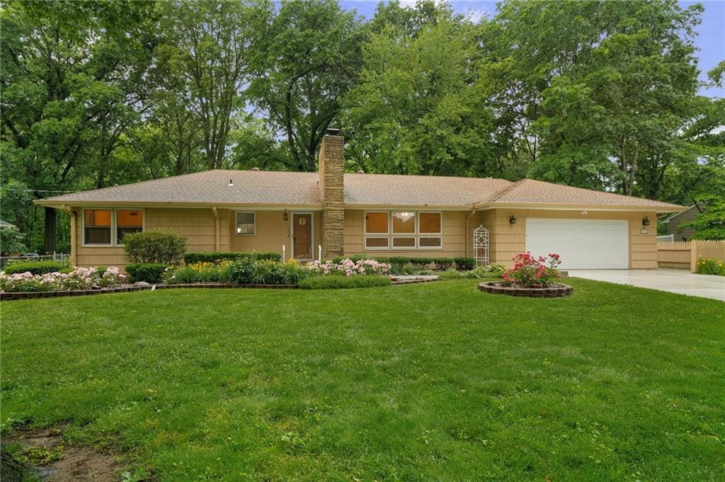 6810 Glenwood St, Overland Park, KS 66204 - single story home featuring a garage, driveway, and a chimney