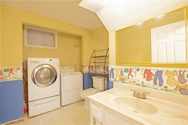 clothes washing area featuring separate washer and dryer