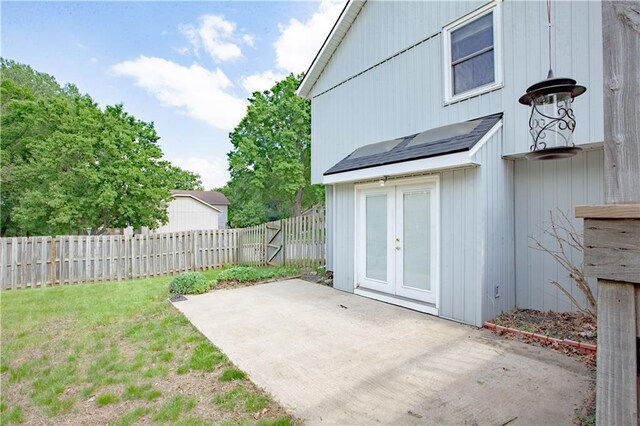 view of yard with a patio and french doors