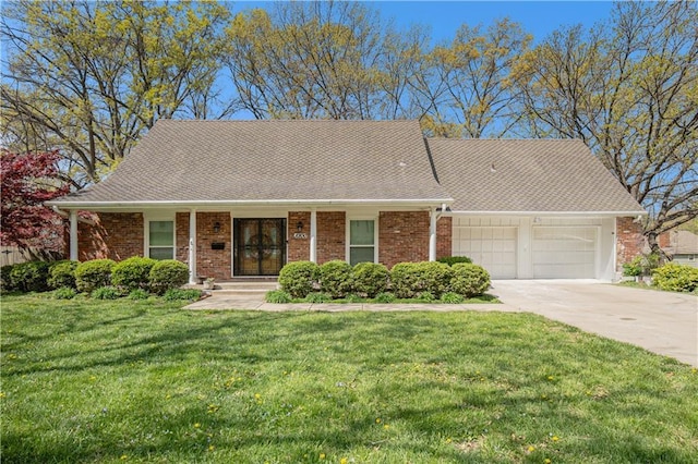 10100 El Monte St, Overland Park, KS 66207 - ranch-style house featuring roof with shingles, an attached garage, brick siding, a front yard, and concrete driveway