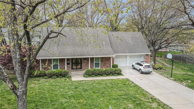 10100 El Monte St, Overland Park, KS 66207 - single story home with fence, an attached garage, a front lawn, brick siding, and concrete driveway