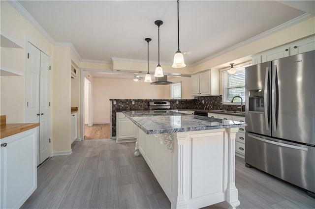 10100 El Monte St, Overland Park, KS 66207 - kitchen featuring decorative backsplash, a peninsula, stainless steel refrigerator with ice dispenser, wall chimney exhaust hood, and a sink