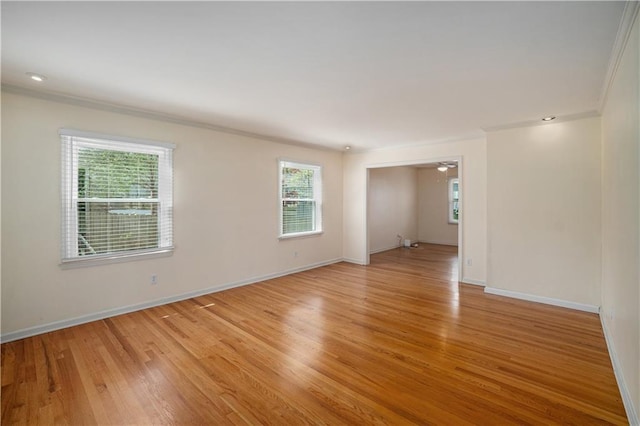 10100 El Monte St, Overland Park, KS 66207 - unfurnished room with crown molding, plenty of natural light, and light wood finished floors