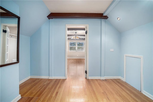 10100 El Monte St, Overland Park, KS 66207 - additional living space featuring vaulted ceiling with beams, baseboards, visible vents, and wood finished floors