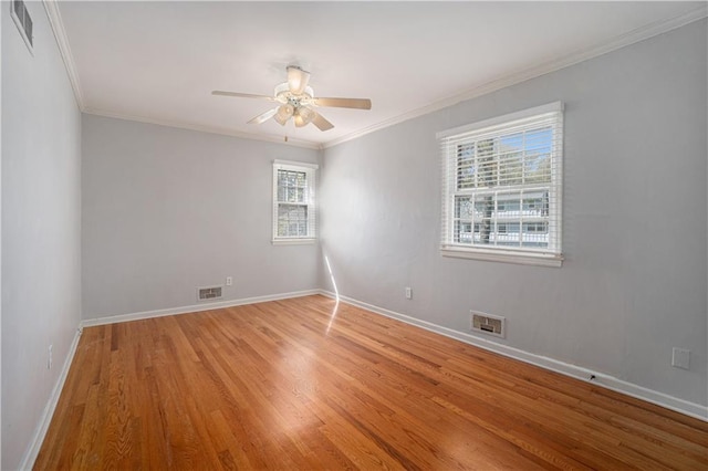 10100 El Monte St, Overland Park, KS 66207 - empty room featuring crown molding, visible vents, and light wood-style flooring