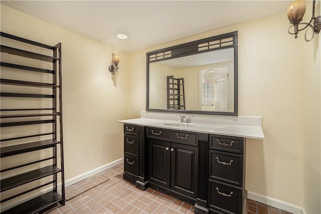 10100 El Monte St, Overland Park, KS 66207 - bathroom featuring radiator heating unit, baseboards, brick floor, and vanity