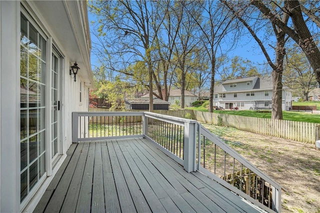 10100 El Monte St, Overland Park, KS 66207 - wooden deck featuring a residential view and a fenced backyard