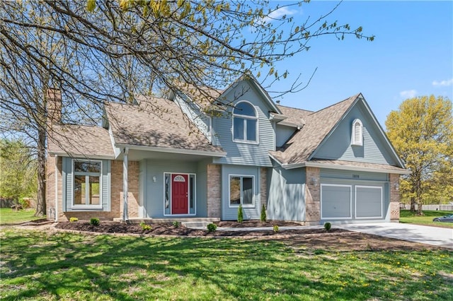 1010 SW Cross Creek Dr, Grain Valley, MO 64029 - traditional home featuring roof with shingles, concrete driveway, brick siding, a front yard, and a garage