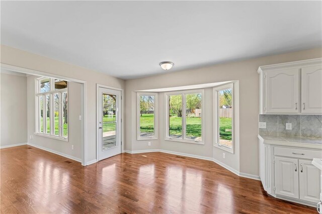 1010 SW Cross Creek Dr, Grain Valley, MO 64029 - interior space with baseboards and dark wood-style floors