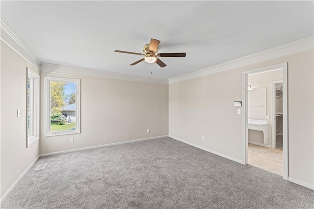 1010 SW Cross Creek Dr, Grain Valley, MO 64029 - spare room with crown molding, light colored carpet, and a ceiling fan