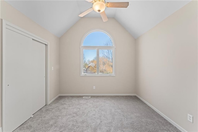 1010 SW Cross Creek Dr, Grain Valley, MO 64029 - unfurnished bedroom with a closet, light carpet, lofted ceiling, and baseboards