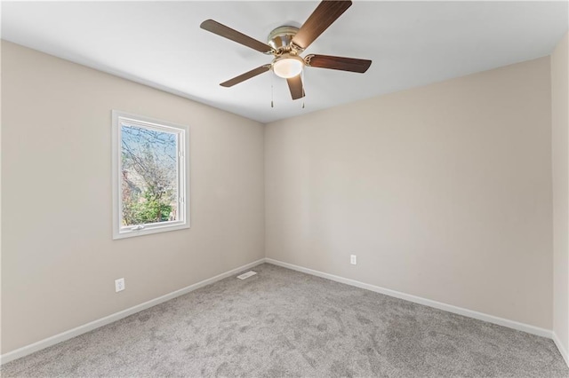 1010 SW Cross Creek Dr, Grain Valley, MO 64029 - carpeted spare room with visible vents, baseboards, and ceiling fan