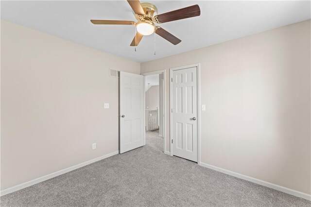 1010 SW Cross Creek Dr, Grain Valley, MO 64029 - unfurnished bedroom featuring visible vents, baseboards, carpet floors, and ceiling fan