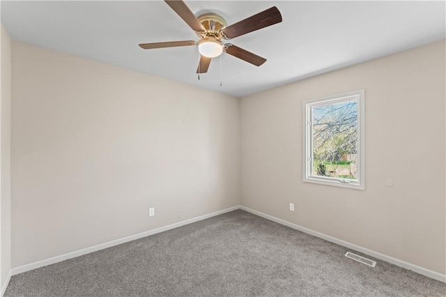 1010 SW Cross Creek Dr, Grain Valley, MO 64029 - carpeted spare room featuring visible vents, baseboards, and ceiling fan