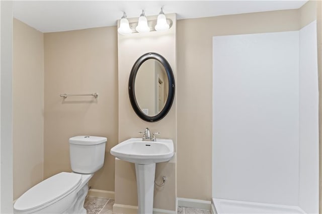 1010 SW Cross Creek Dr, Grain Valley, MO 64029 - bathroom featuring baseboards and toilet