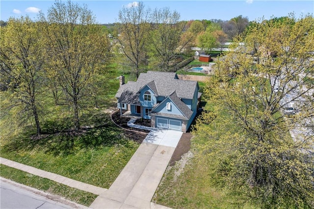 1010 SW Cross Creek Dr, Grain Valley, MO 64029 - bird's eye view featuring a wooded view