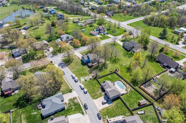 1010 SW Cross Creek Dr, Grain Valley, MO 64029 - birds eye view of property featuring a water view and a residential view