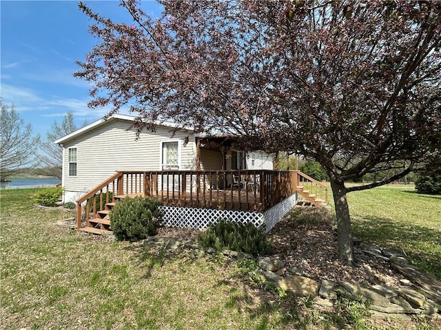 171 E 5th St, Schell City, MO 64783 - rear view of property featuring a deck with water view and a yard