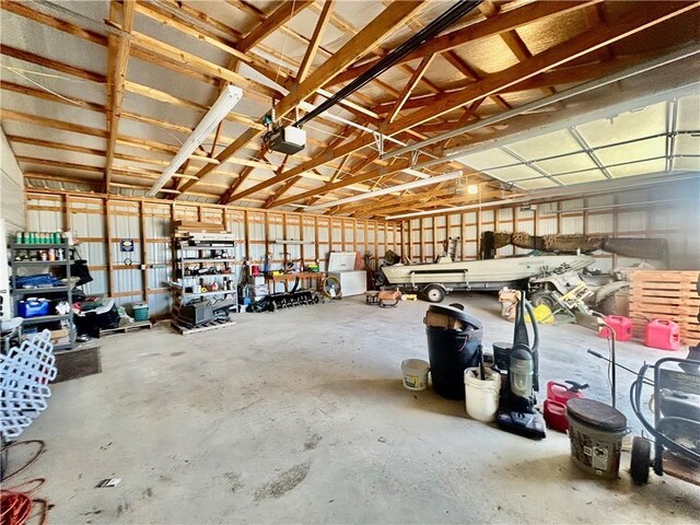 171 E 5th St, Schell City, MO 64783 - garage featuring a garage door opener