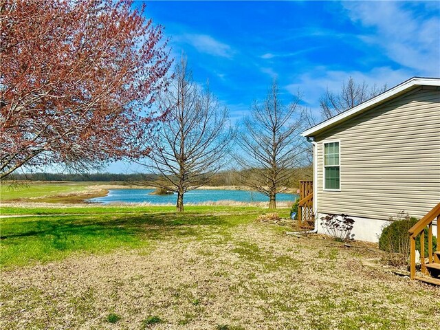 171 E 5th St, Schell City, MO 64783 - view of yard with a water view