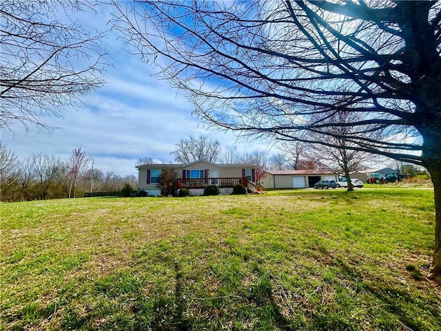 171 E 5th St, Schell City, MO 64783 - view of yard featuring a deck